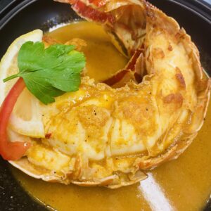 La Demi Queue de Langouste Flambée au Cognac