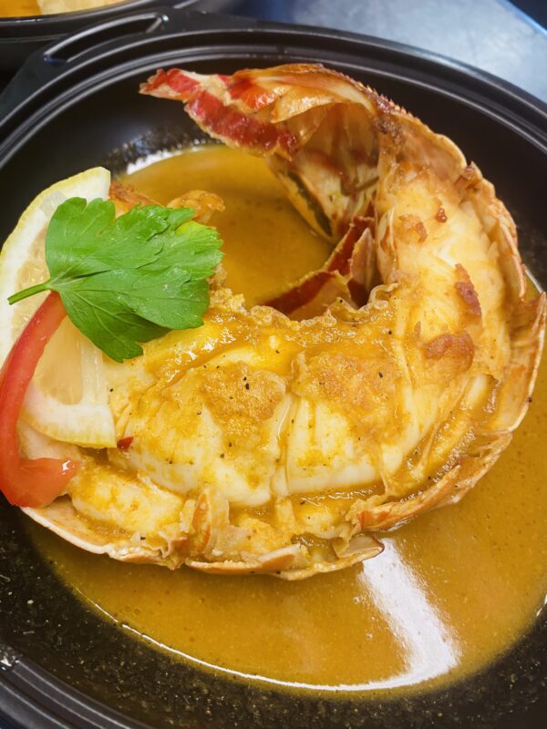 La Demi Queue de Langouste Flambée au Cognac